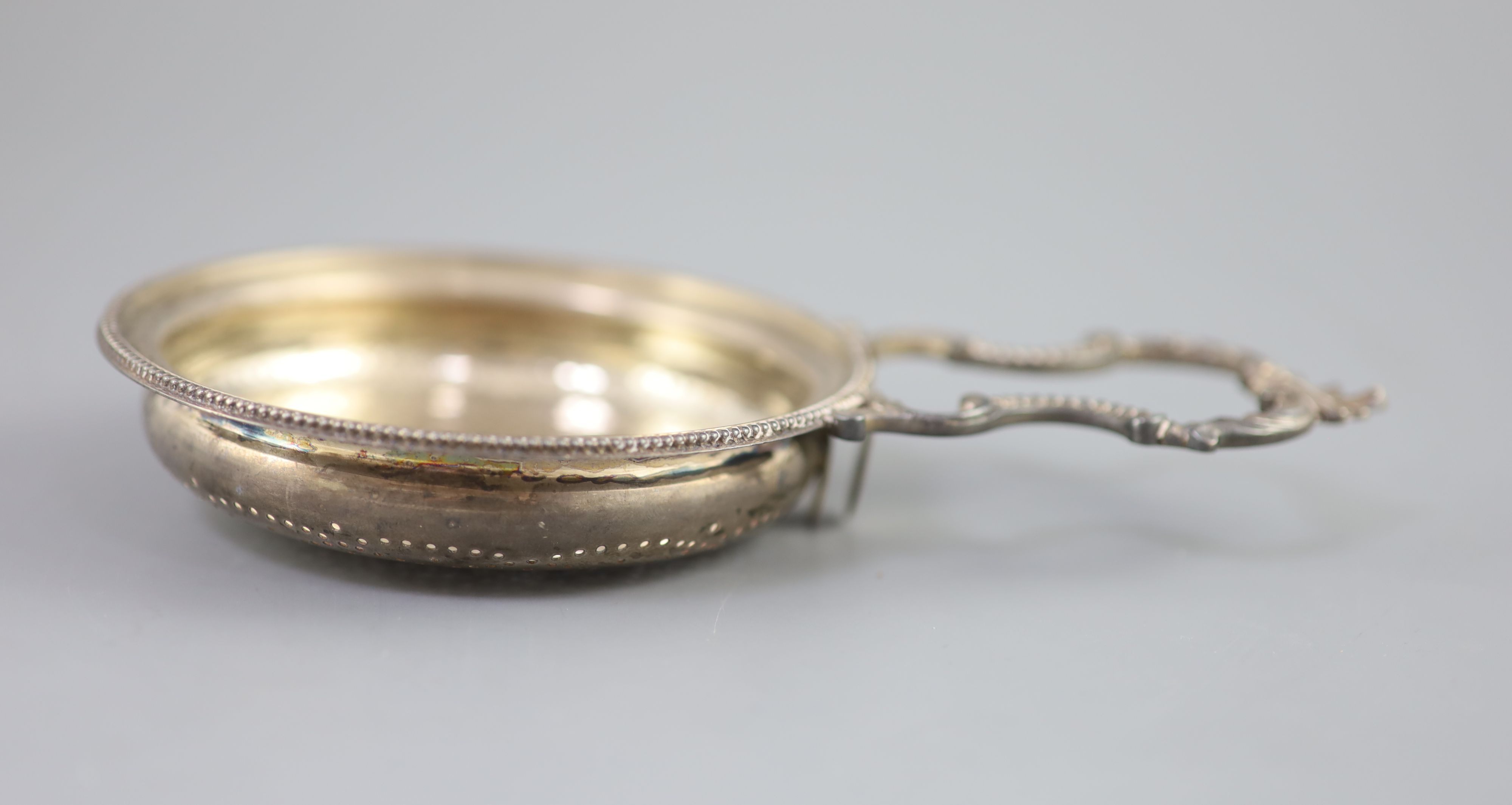 A George III silver single handled lemon strainer, London, 1779,